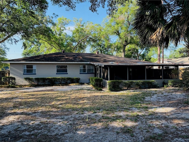 rear view of house with a sunroom
