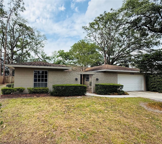 ranch-style home with a garage and concrete driveway