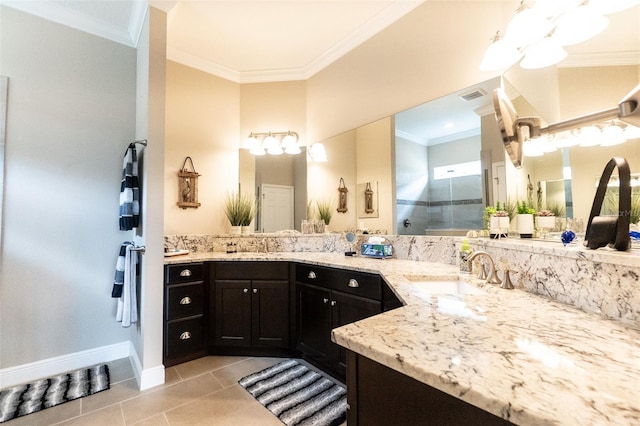 bathroom featuring tile patterned floors, crown molding, visible vents, and a sink