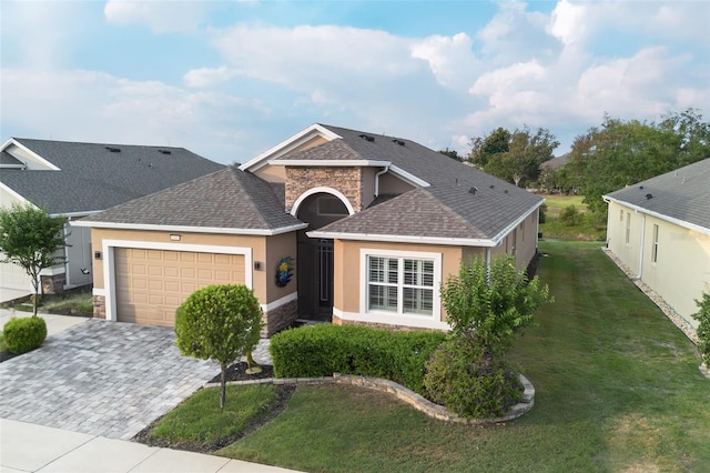 2435 Pawtucket Pass, Mount Dora, FL 32757 - view of front of property with stone siding, stucco siding, roof with shingles, an attached garage, and a front lawn