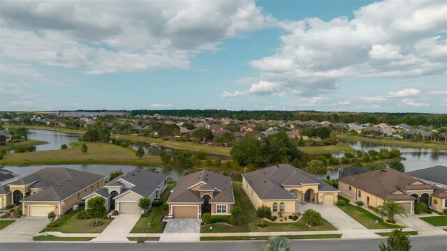 2435 Pawtucket Pass, Mount Dora, FL 32757 - aerial view of residential area featuring a nearby body of water