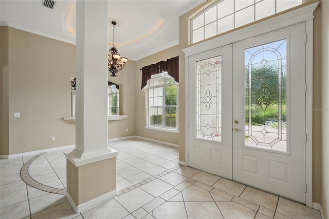 1641 Timber Hills Dr, Deland, FL 32724 - entrance foyer featuring light tile patterned floors, french doors, a chandelier, and baseboards