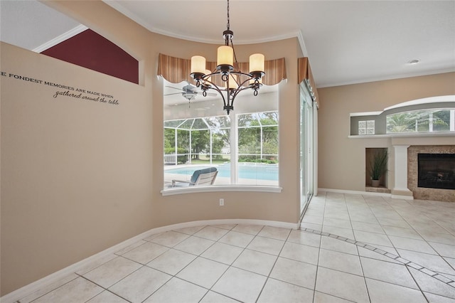 1641 Timber Hills Dr, Deland, FL 32724 - unfurnished dining area with light tile patterned flooring, a tiled fireplace, a chandelier, crown molding, and baseboards