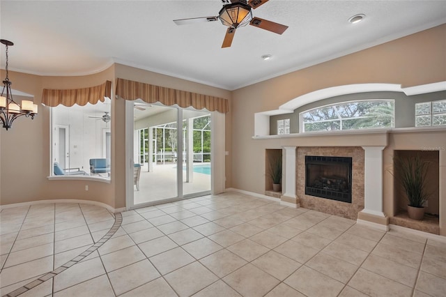 1641 Timber Hills Dr, Deland, FL 32724 - unfurnished living room featuring tile patterned floors, a ceiling fan, a tile fireplace, ornamental molding, and a chandelier