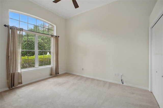 1641 Timber Hills Dr, Deland, FL 32724 - unfurnished room featuring healthy amount of natural light, light colored carpet, a ceiling fan, baseboards, and crown molding