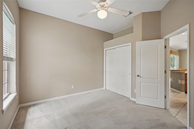 1641 Timber Hills Dr, Deland, FL 32724 - unfurnished bedroom with light colored carpet, baseboards, and a closet
