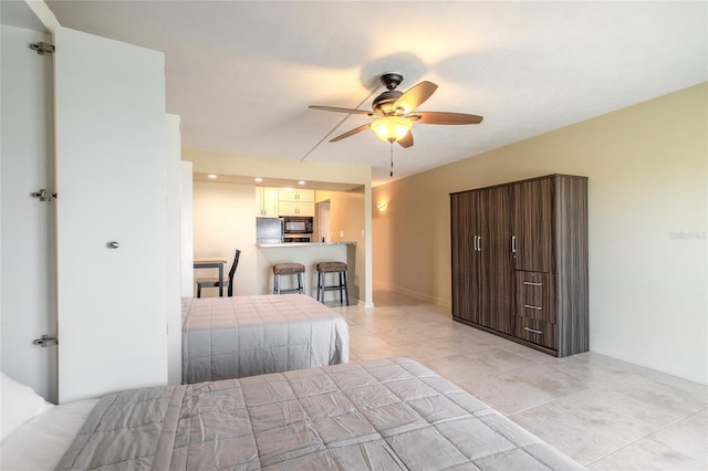 bedroom with light tile patterned floors, baseboards, and a ceiling fan