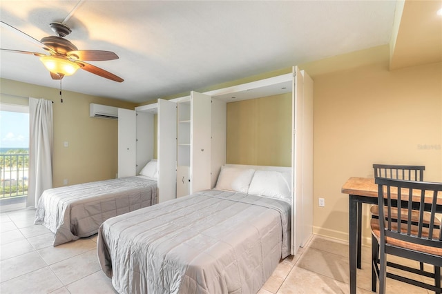 bedroom featuring a ceiling fan, light tile patterned floors, access to exterior, and an AC wall unit