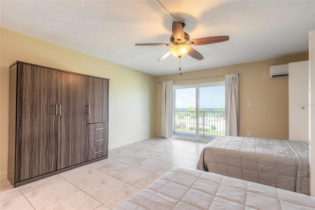 bedroom with light tile patterned floors, access to outside, a ceiling fan, and an AC wall unit