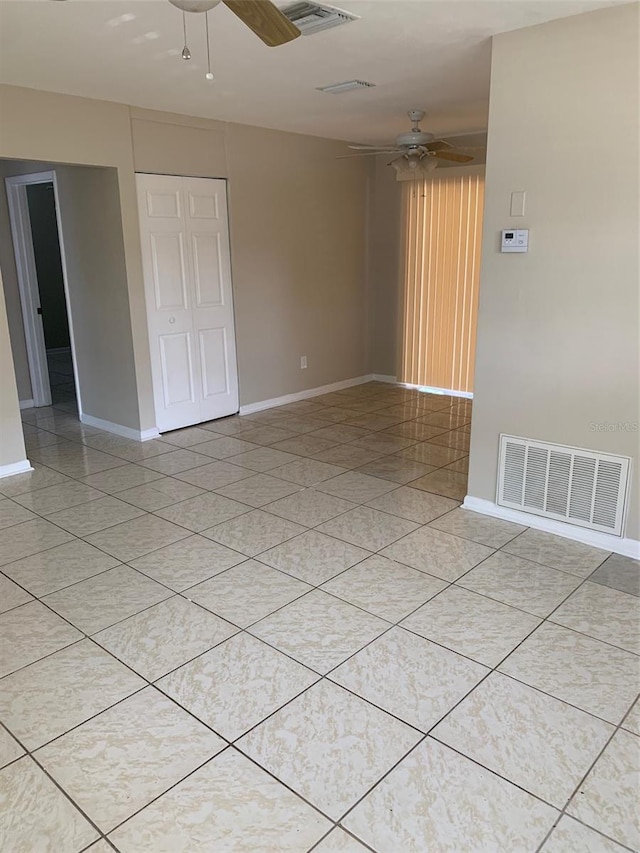 1626 S Page Dr, Deltona, FL 32725 - empty room with a ceiling fan, baseboards, and light tile patterned floors
