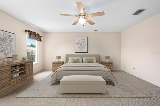 11094 SE 173rd Ln, Summerfield, FL 34491 - bedroom with light colored carpet, baseboards, and ceiling fan