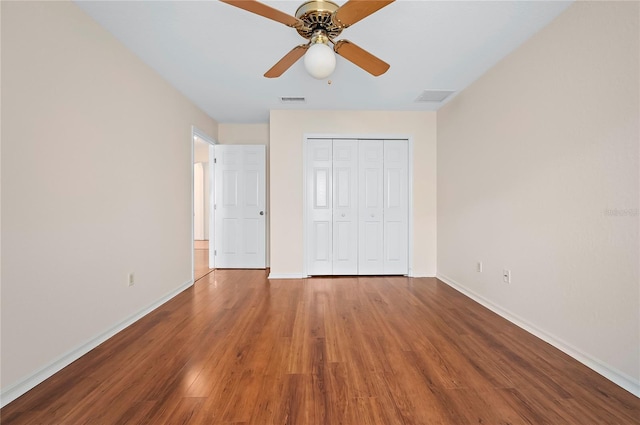11094 SE 173rd Ln, Summerfield, FL 34491 - unfurnished bedroom with baseboards, wood finished floors, a closet, and ceiling fan