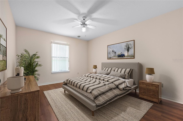 11094 SE 173rd Ln, Summerfield, FL 34491 - bedroom featuring baseboards, dark wood-style flooring, and a ceiling fan