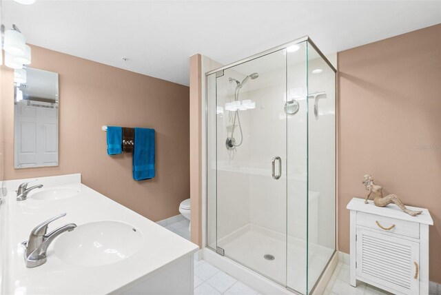 2967 S Atlantic Ave Unit 1601, Daytona Beach Shores, FL 32118 - full bath featuring a sink, double vanity, toilet, and a shower stall