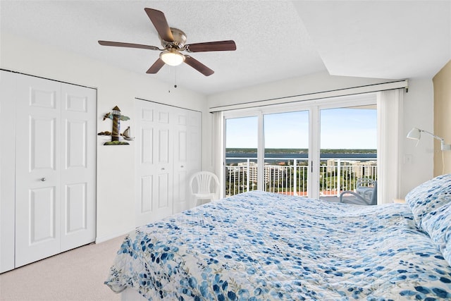 2967 S Atlantic Ave Unit 1601, Daytona Beach Shores, FL 32118 - bedroom featuring ceiling fan, a textured ceiling, carpet, and access to exterior