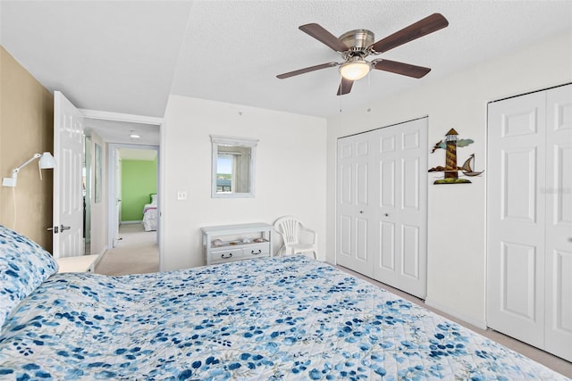 2967 S Atlantic Ave Unit 1601, Daytona Beach Shores, FL 32118 - bedroom featuring carpet, two closets, a ceiling fan, and a textured ceiling