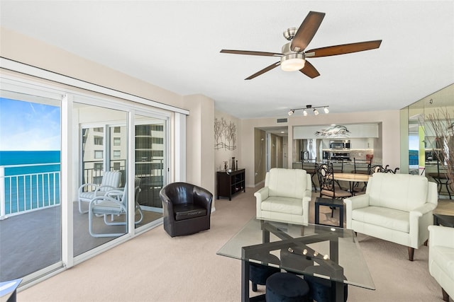 2967 S Atlantic Ave Unit 1601, Daytona Beach Shores, FL 32118 - living area with carpet flooring, visible vents, and ceiling fan