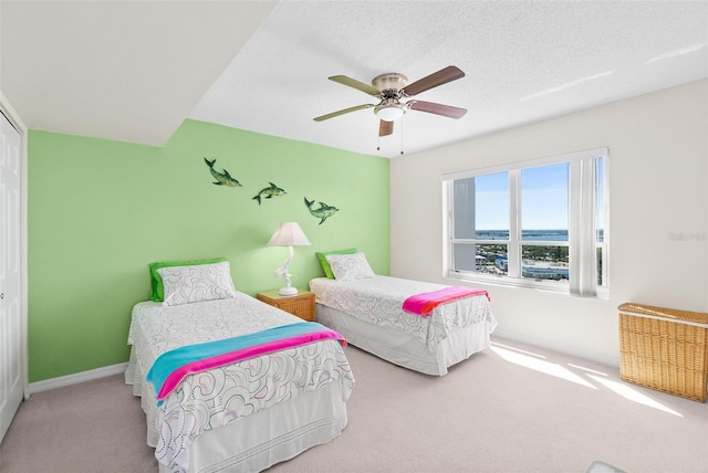 2967 S Atlantic Ave Unit 1601, Daytona Beach Shores, FL 32118 - carpeted bedroom featuring a ceiling fan and baseboards