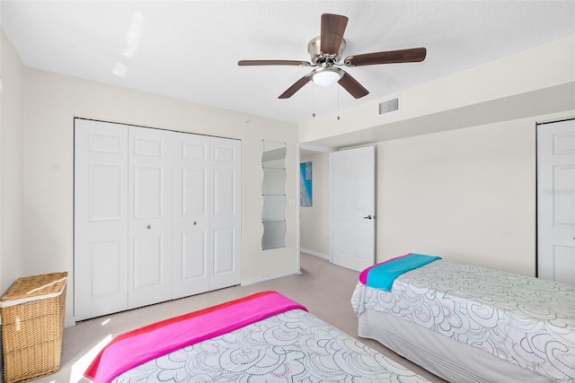 2967 S Atlantic Ave Unit 1601, Daytona Beach Shores, FL 32118 - carpeted bedroom with ceiling fan, a closet, and visible vents