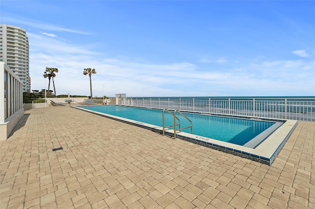 2967 S Atlantic Ave Unit 1601, Daytona Beach Shores, FL 32118 - community pool featuring a patio area and fence