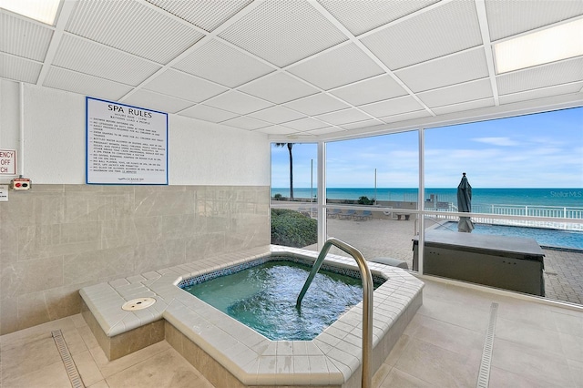 2967 S Atlantic Ave Unit 1601, Daytona Beach Shores, FL 32118 - view of pool featuring an indoor in ground hot tub and a water view