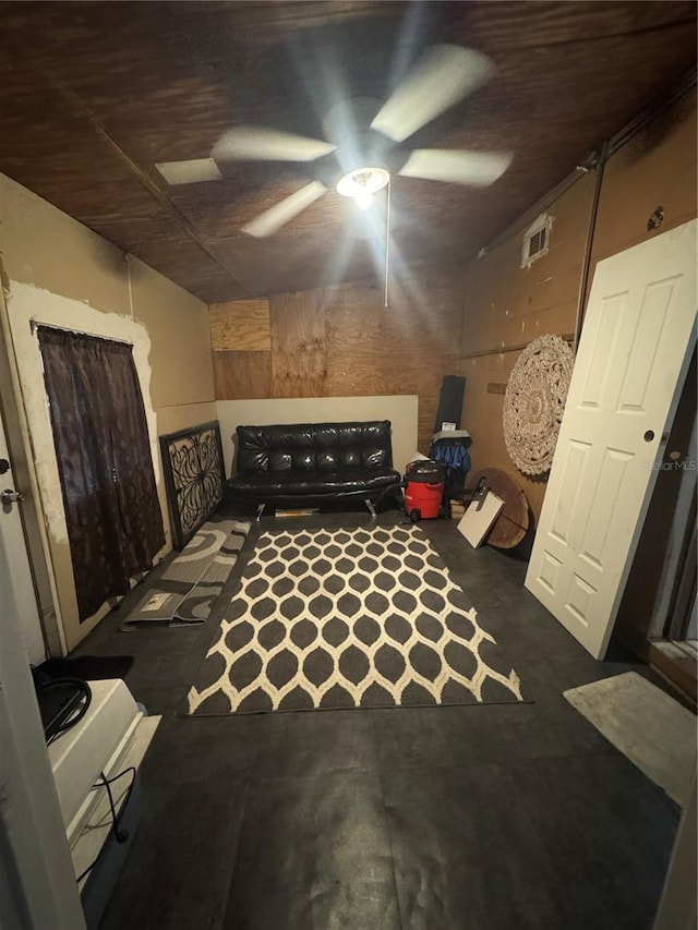 bedroom featuring a ceiling fan, visible vents, and concrete floors
