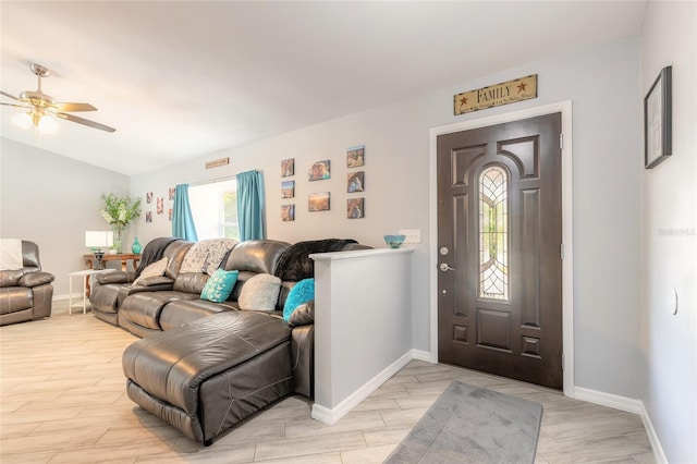 85 Pheasant Dr, Palm Coast, FL 32164 - entryway with light wood-style flooring, ceiling fan, baseboards, and vaulted ceiling