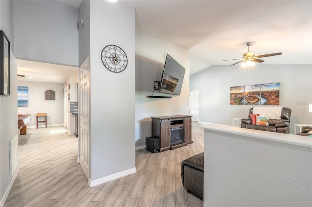 85 Pheasant Dr, Palm Coast, FL 32164 - hall with light wood finished floors, baseboards, and lofted ceiling