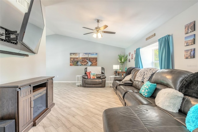 85 Pheasant Dr, Palm Coast, FL 32164 - living area with ceiling fan, light wood-style flooring, vaulted ceiling, and baseboards