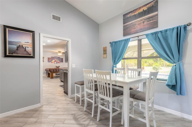 85 Pheasant Dr, Palm Coast, FL 32164 - dining space featuring high vaulted ceiling, baseboards, light wood finished floors, and ceiling fan