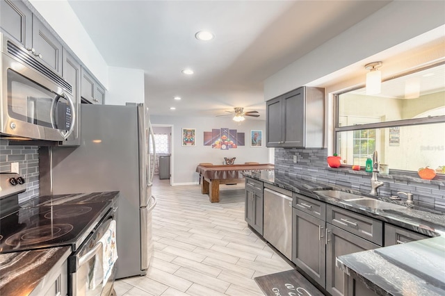 85 Pheasant Dr, Palm Coast, FL 32164 - kitchen featuring appliances with stainless steel finishes, tasteful backsplash, a sink, recessed lighting, and a ceiling fan