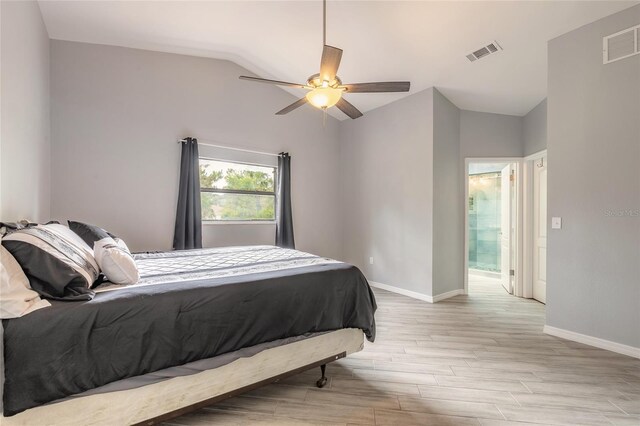 85 Pheasant Dr, Palm Coast, FL 32164 - bedroom featuring vaulted ceiling, light wood-type flooring, baseboards, and a ceiling fan