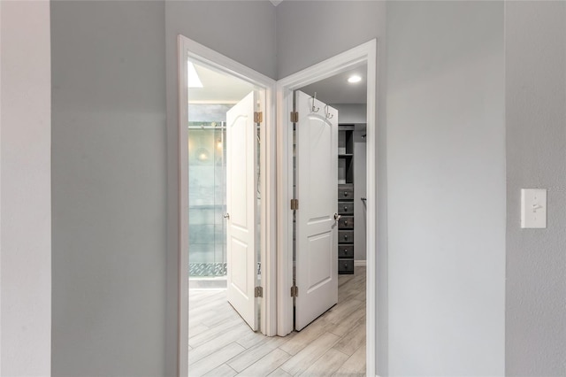 85 Pheasant Dr, Palm Coast, FL 32164 - hall with light wood-style floors and baseboards