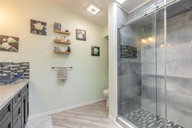 85 Pheasant Dr, Palm Coast, FL 32164 - bathroom with toilet, vanity, a shower stall, and baseboards