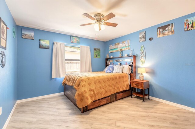 85 Pheasant Dr, Palm Coast, FL 32164 - bedroom with wood finished floors, baseboards, and ceiling fan