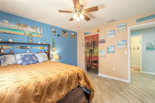 85 Pheasant Dr, Palm Coast, FL 32164 - bedroom featuring wood finished floors, baseboards, and a ceiling fan