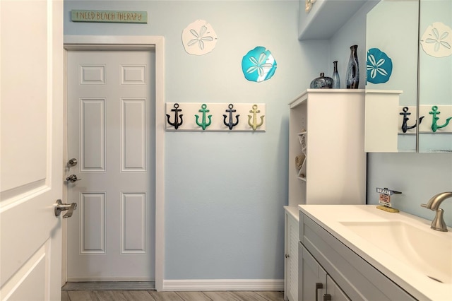 85 Pheasant Dr, Palm Coast, FL 32164 - bathroom featuring vanity and baseboards