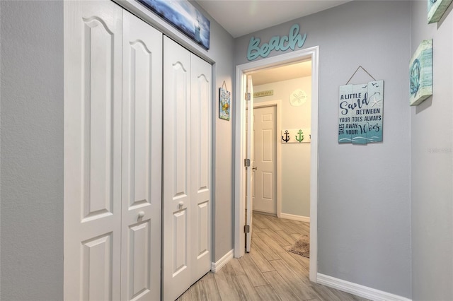 85 Pheasant Dr, Palm Coast, FL 32164 - corridor with light wood-type flooring and baseboards