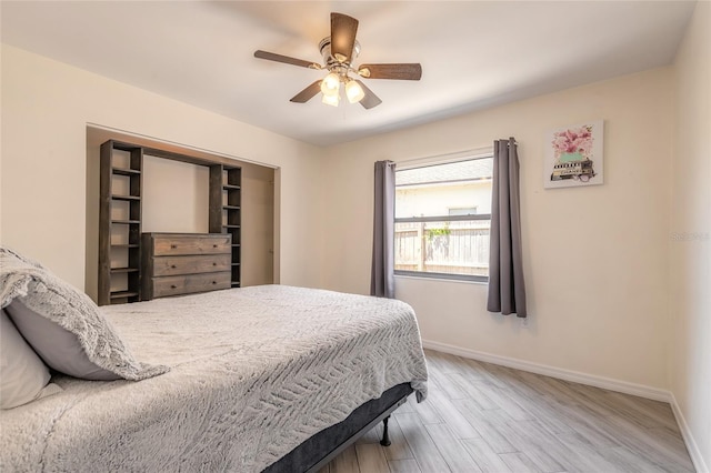85 Pheasant Dr, Palm Coast, FL 32164 - bedroom featuring baseboards, wood finished floors, and ceiling fan