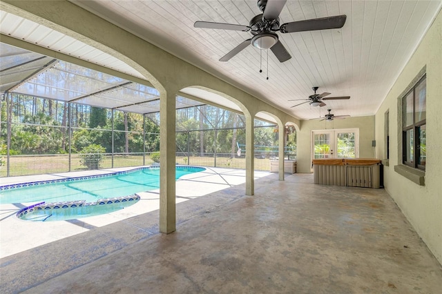 85 Pheasant Dr, Palm Coast, FL 32164 - view of swimming pool with ceiling fan, a patio area, glass enclosure, and a pool with connected hot tub