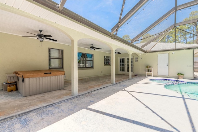 85 Pheasant Dr, Palm Coast, FL 32164 - view of swimming pool featuring ceiling fan, french doors, a patio area, a lanai, and a pool with connected hot tub
