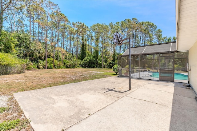 85 Pheasant Dr, Palm Coast, FL 32164 - view of patio / terrace with an outdoor pool and glass enclosure