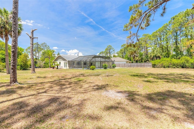 85 Pheasant Dr, Palm Coast, FL 32164 - view of yard featuring a lanai