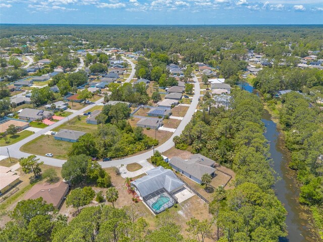 85 Pheasant Dr, Palm Coast, FL 32164 - aerial overview of property's location with nearby suburban area and a large body of water