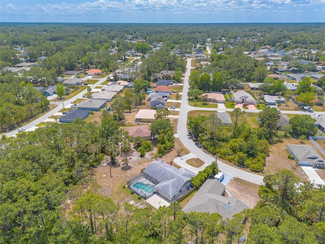 85 Pheasant Dr, Palm Coast, FL 32164 - aerial overview of property's location featuring nearby suburban area and a forest