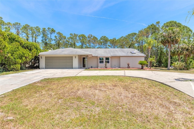 85 Pheasant Dr, Palm Coast, FL 32164 - ranch-style house featuring driveway, an attached garage, and a front lawn