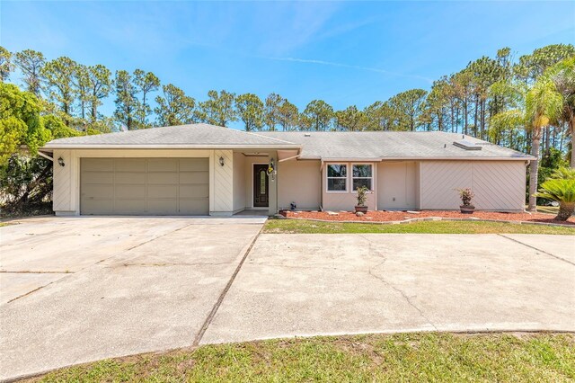 85 Pheasant Dr, Palm Coast, FL 32164 - view of front of property with an attached garage and concrete driveway