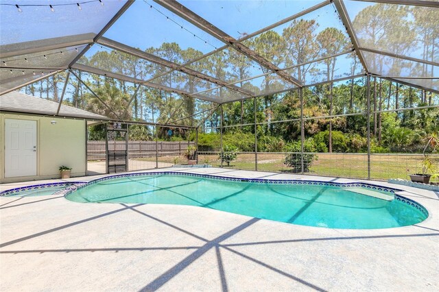 85 Pheasant Dr, Palm Coast, FL 32164 - view of pool featuring a patio area, a lanai, and a pool with connected hot tub