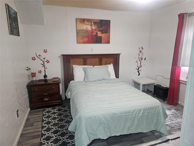 317 Inwood Ave, New Smyrna Beach, FL 32168 - bedroom with baseboards and wood finished floors