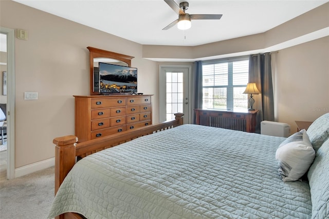 carpeted bedroom featuring baseboards and ceiling fan